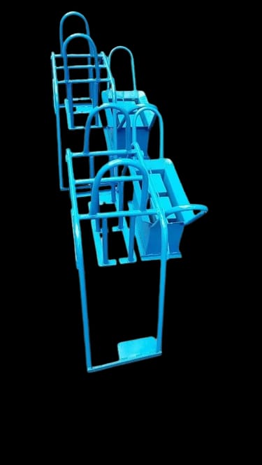 Stacked blue metal trolley frames manufactured in the GRANFI workshop
